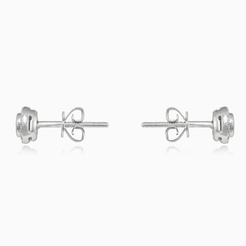 White gold stud earrings with sapphire and diamond halo