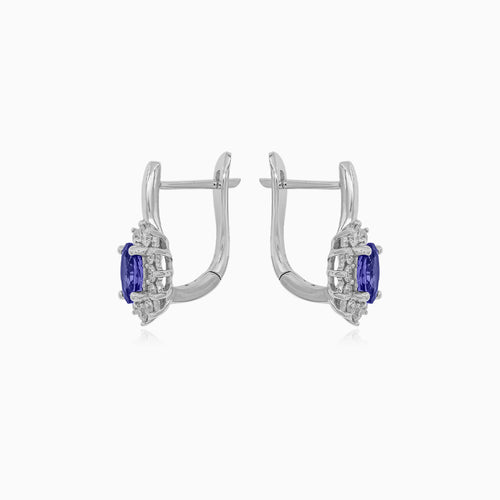 White gold tanzanite and diamond halo earrings