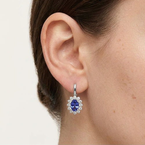 White gold tanzanite and diamond halo earrings