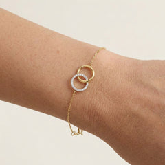 Gold bracelet with interlocking circles and diamonds