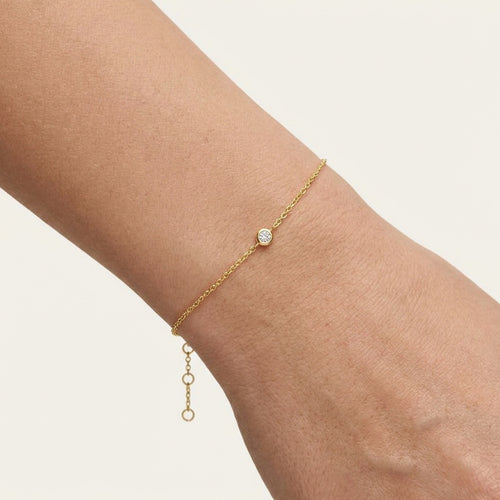 Yellow gold bracelet with a bezel-set diamond