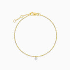 Yellow gold bracelet with a suspended diamond