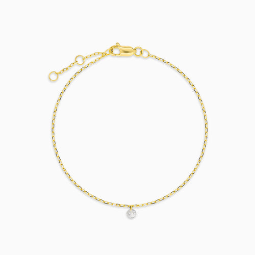 Yellow gold bracelet with a suspended diamond