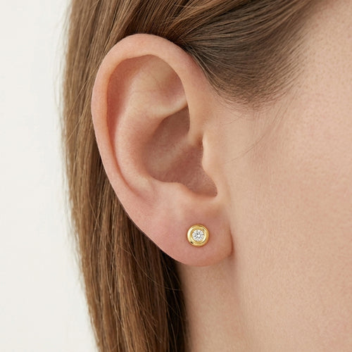 Bezel set gold stud earrings