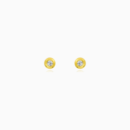 Boucles d'oreilles clous en or avec serti.