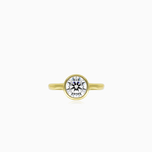 Yellow gold bezel set lustrous ring