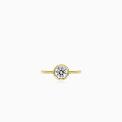 Yellow gold bezel set lustrous ring