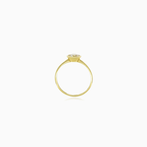 Yellow gold bezel set lustrous ring