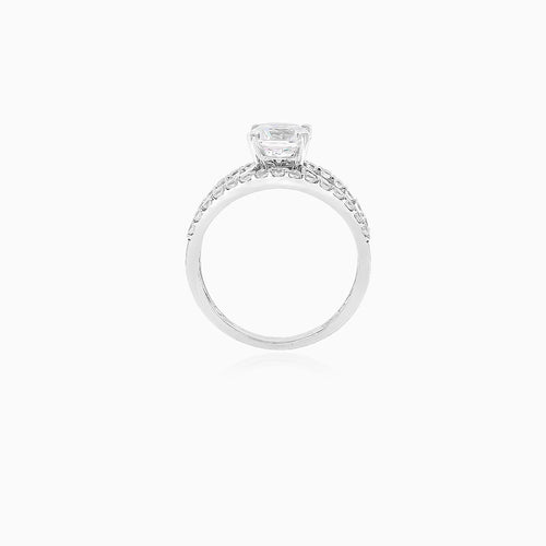 White gold ring with central cubic zirconia and side zircons