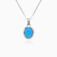 Oval cut blue opal white gold pendant