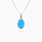 Simple blue opal solitaire pendant
