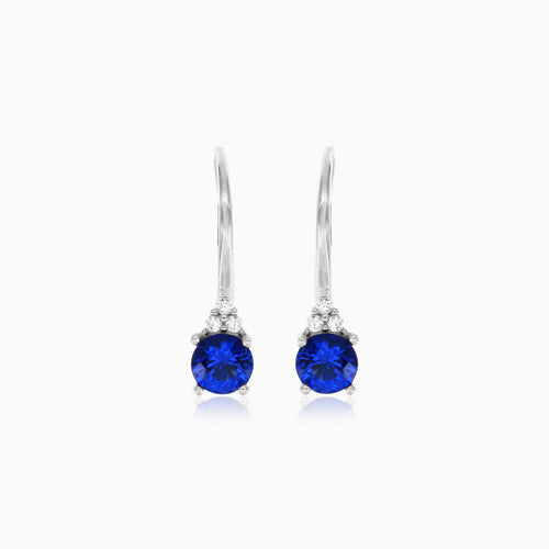 White gold sapphire earrings with zirconia trio