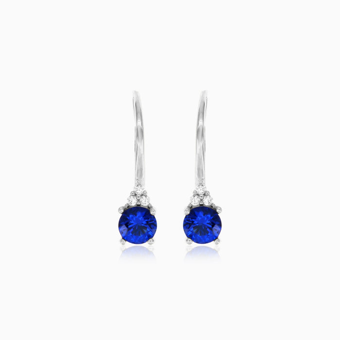 White gold sapphire earrings with zirconia trio