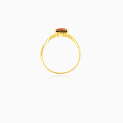 Yellow gold ring with oval cut garnet