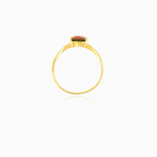 Yellow gold ring with oval cut garnet