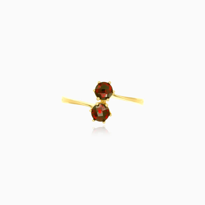 Bague en or jaune avec deux boules de grenat.