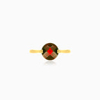 Round-cut garnet solitaire yellow gold ring