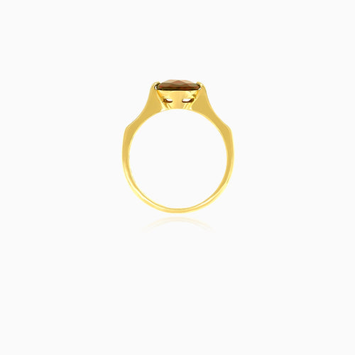 Round-cut garnet solitaire yellow gold ring