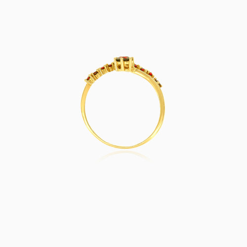 Stylish gold ring with round garnet