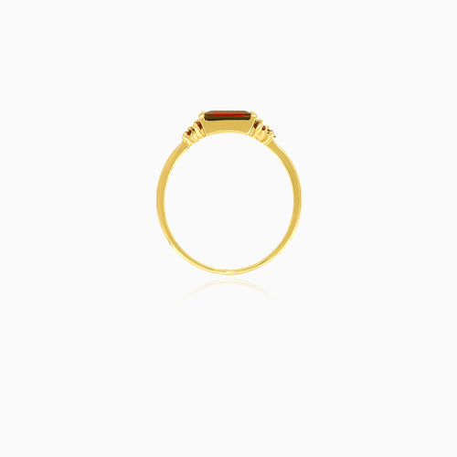 Gold ring with round and rectangular garnets