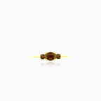 Stylish yellow gold ring with three garnets