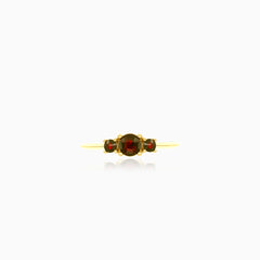 Stylish yellow gold ring with three garnets