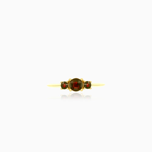 Stylish yellow gold ring with three garnets