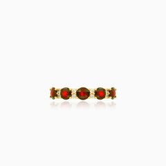 Stylish yellow gold ring with garnet and cubic zirconia