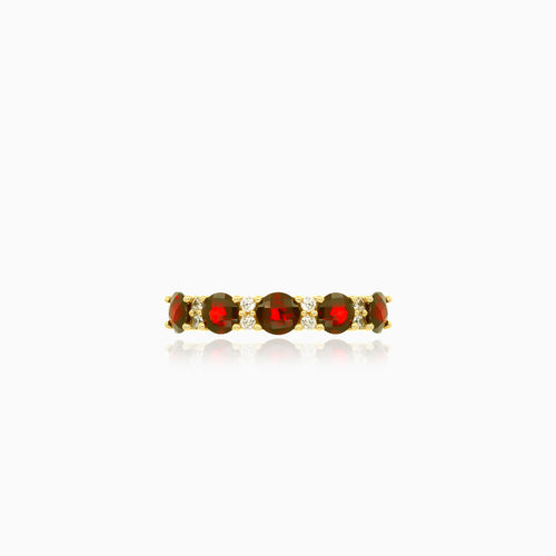 Stylish yellow gold ring with garnet and cubic zirconia