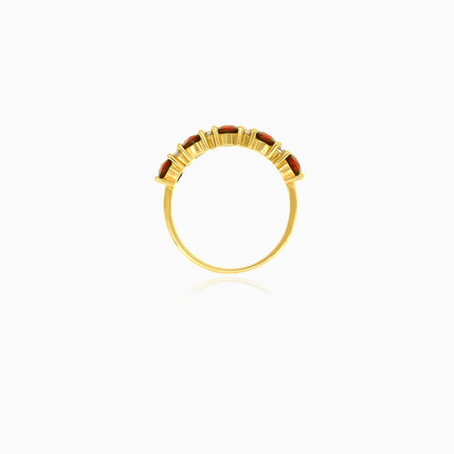 Stylish yellow gold ring with garnet and cubic zirconia