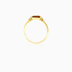 Garnet and cubic zirconia ring in yellow gold