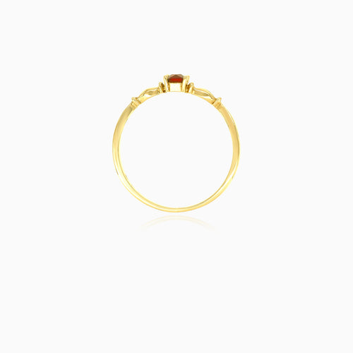 Solitaire garnet yellow gold ring