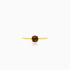 Decorated yellow gold ring with garnet