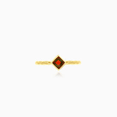 Simple yellow gold ring with solitaire garnet