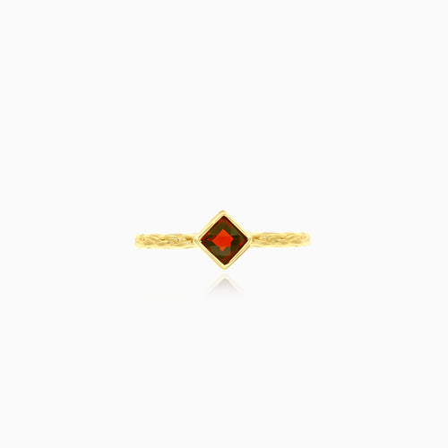 Simple yellow gold ring with solitaire garnet