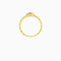 Simple yellow gold ring with solitaire garnet