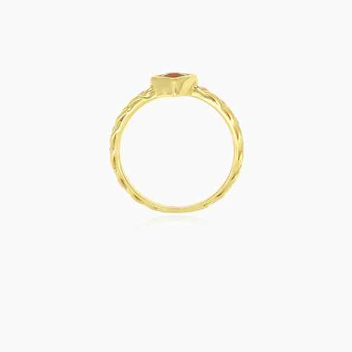 Simple yellow gold ring with solitaire garnet