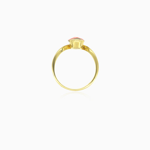 Simple pear cut garnet yellow gold ring