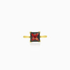 Yellow gold ring with solitaire princess cut garnet