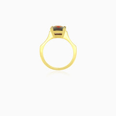 Yellow gold ring with solitaire princess cut garnet