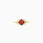 Stylish gold ring with garnet and cubic zirconia