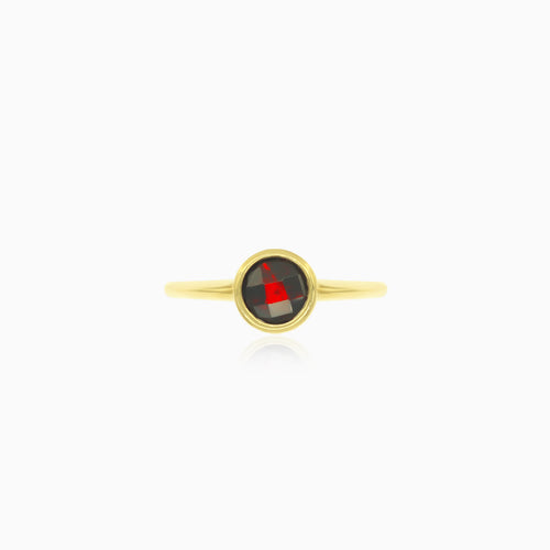 Simple yellow gold ring with solitaire garnet