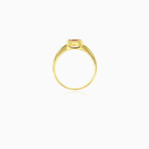 Simple yellow gold ring with solitaire garnet