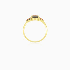 Yellow gold ring with oval and round garnet