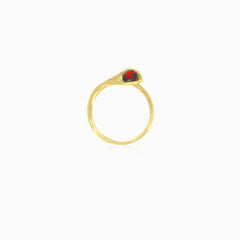 Yellow gold snake ring with garnets