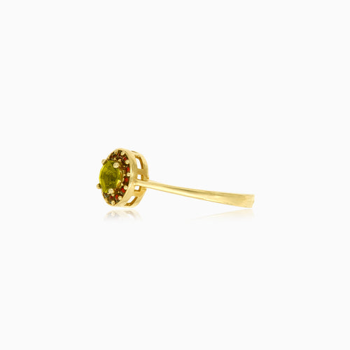 Yellow gold ring with round moldavite and garnets