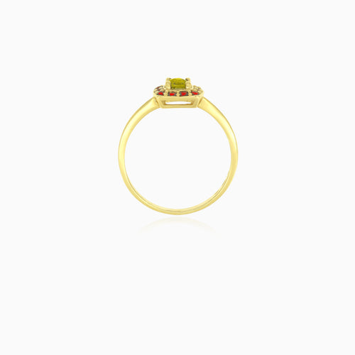 Yellow gold ring with round moldavite and garnet