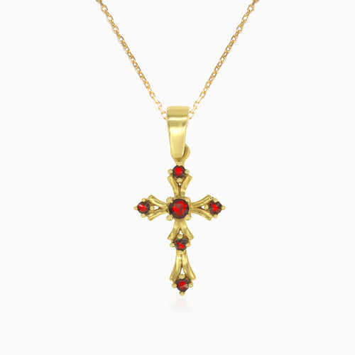 Gold cross pendant with round garnets