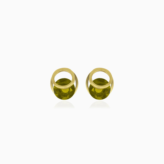 Boucles d'oreilles élégantes en forme d'éclipse avec des moldavites rondes.