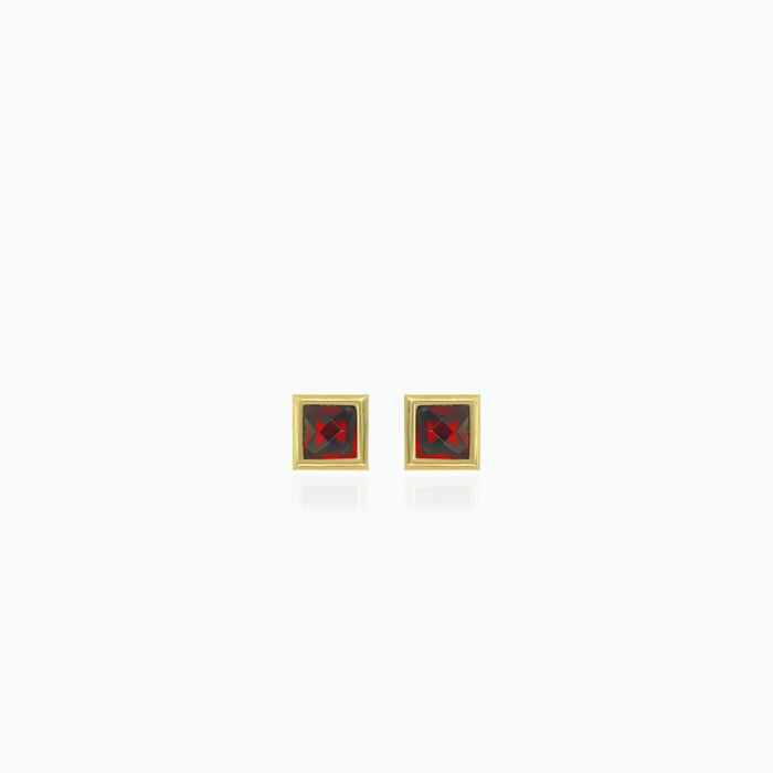 Simple yellow gold stud earrings with solitaire garnet